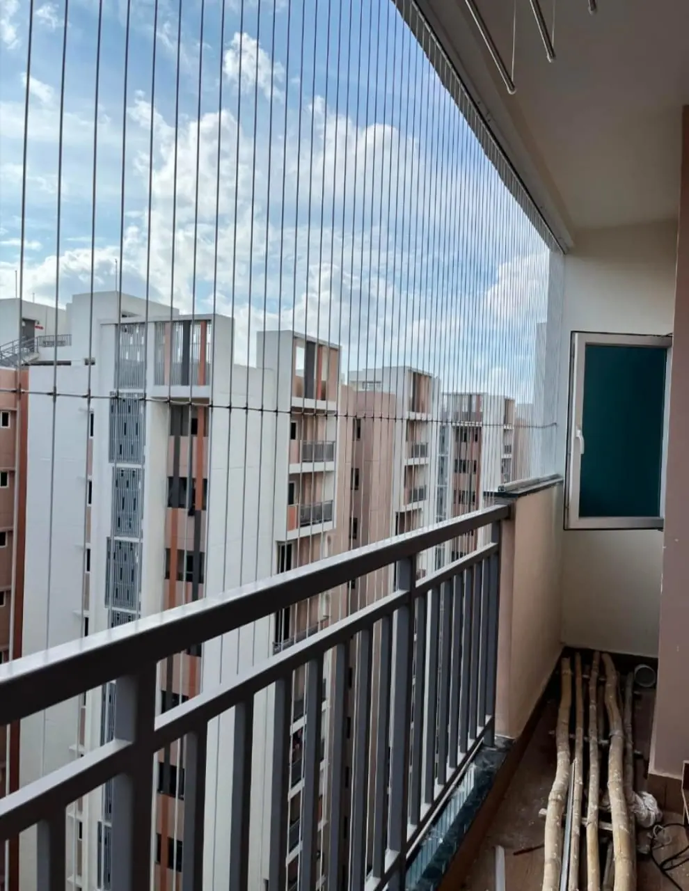 Invisible grill on apartment balcony in Chennai